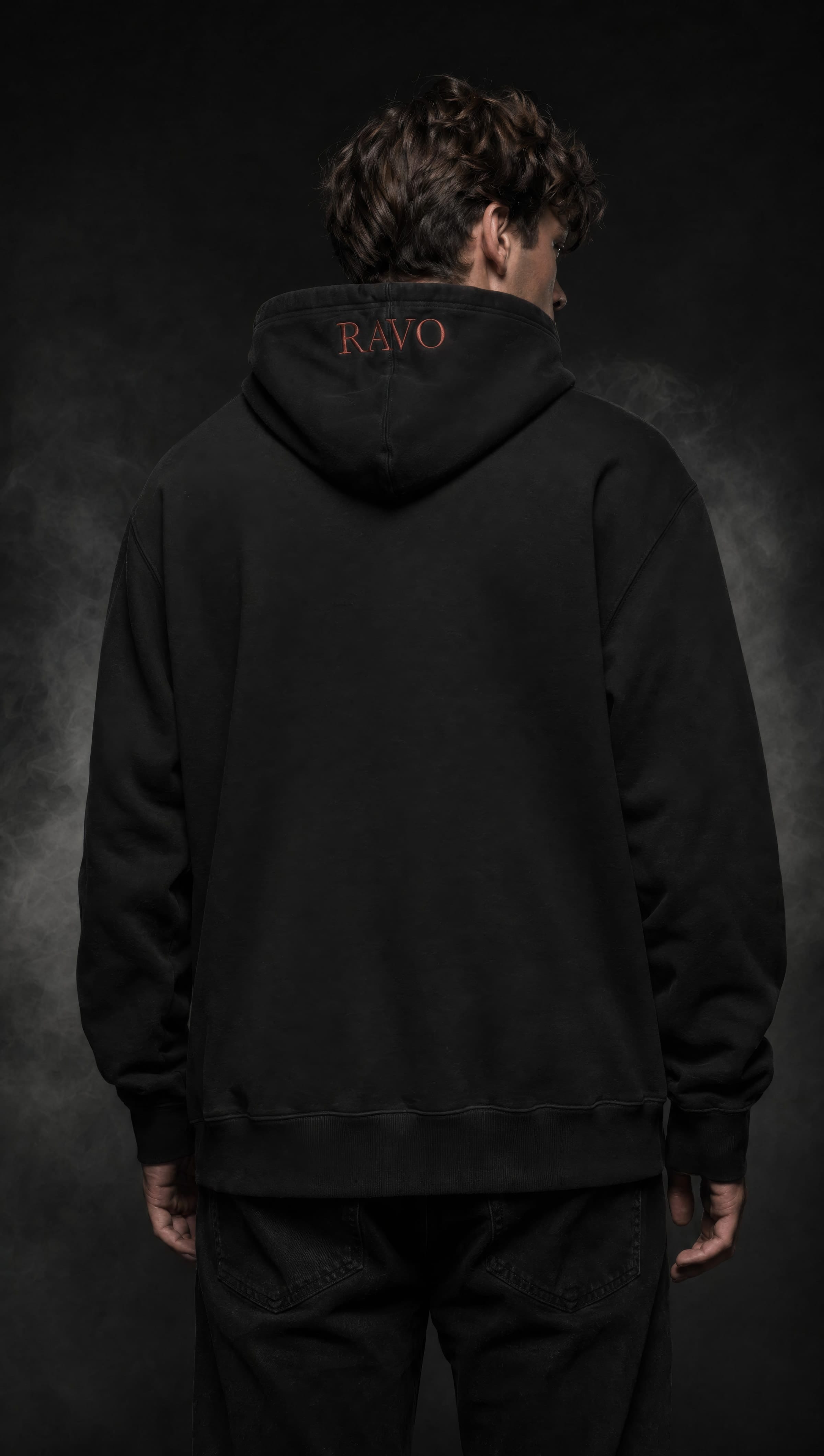 Model wearing RAVO Embroidered Raven Hoodie — back